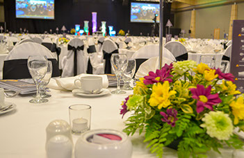 Corporate event with arranged table and audio visual