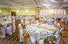 Wedding event with gold and white chair coverings