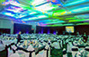 Large neon venue with rented decorated round tables