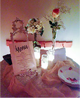Social evetn table setting with menu and flowers